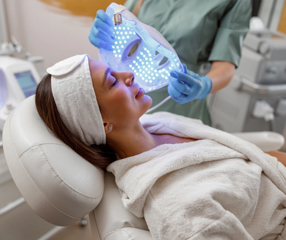 Led Face Mask Being Placed Woman